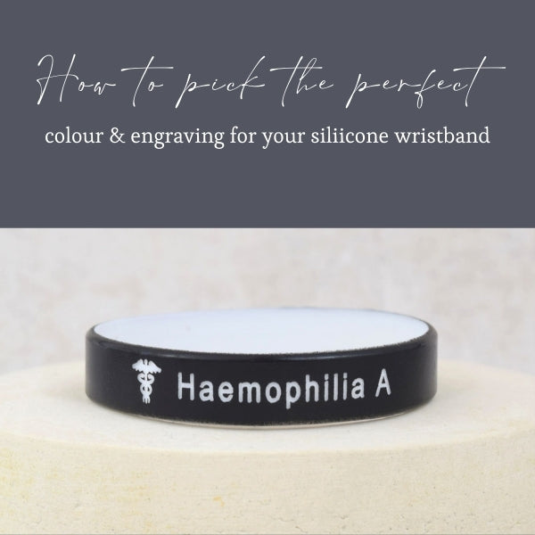 Custom silicone medical wristband showing a black exterior with white interior, ready for engraving