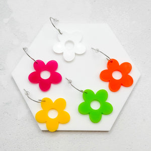 Hippie style flower earrings in multiple colours on a white background