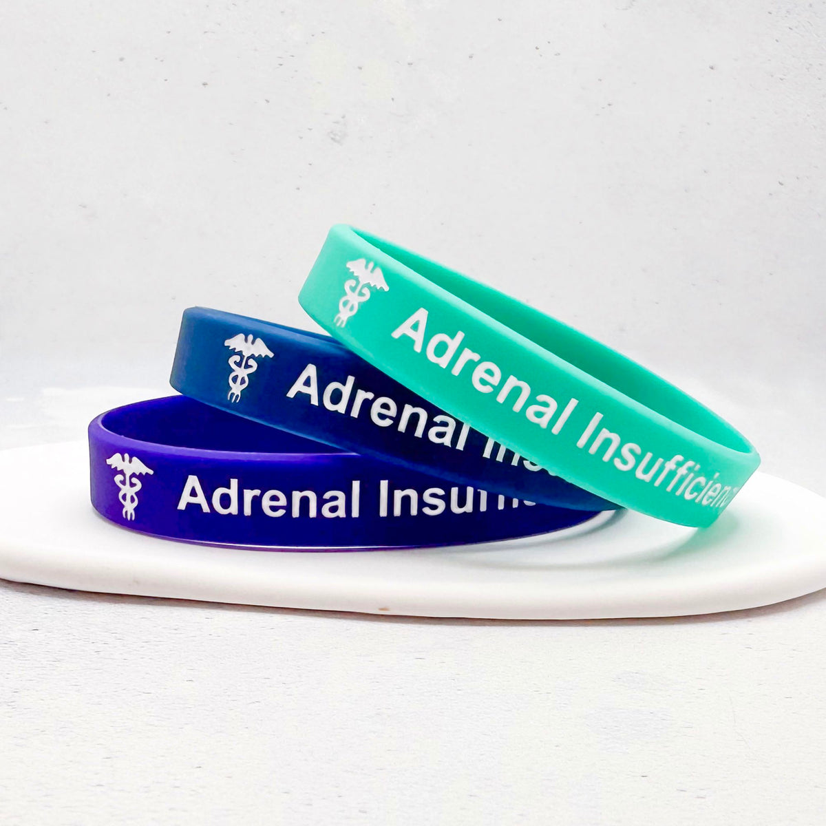 Set of three purple, blue, and teal silicone medical alert wristbands adrenal insufficiency