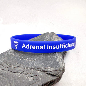 Blue wristband with 'Adrenal Insufficiency' text 