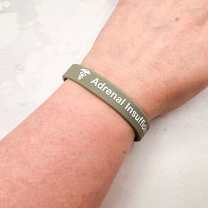 grey silicone adrenal insufficiency medical alert wristband worn on wrist