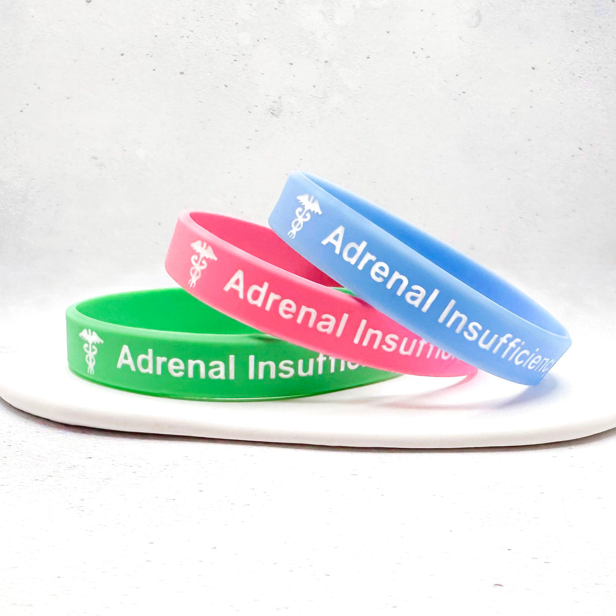 Set of three mint green, pink, and sky blue silicone medical alert wristbands