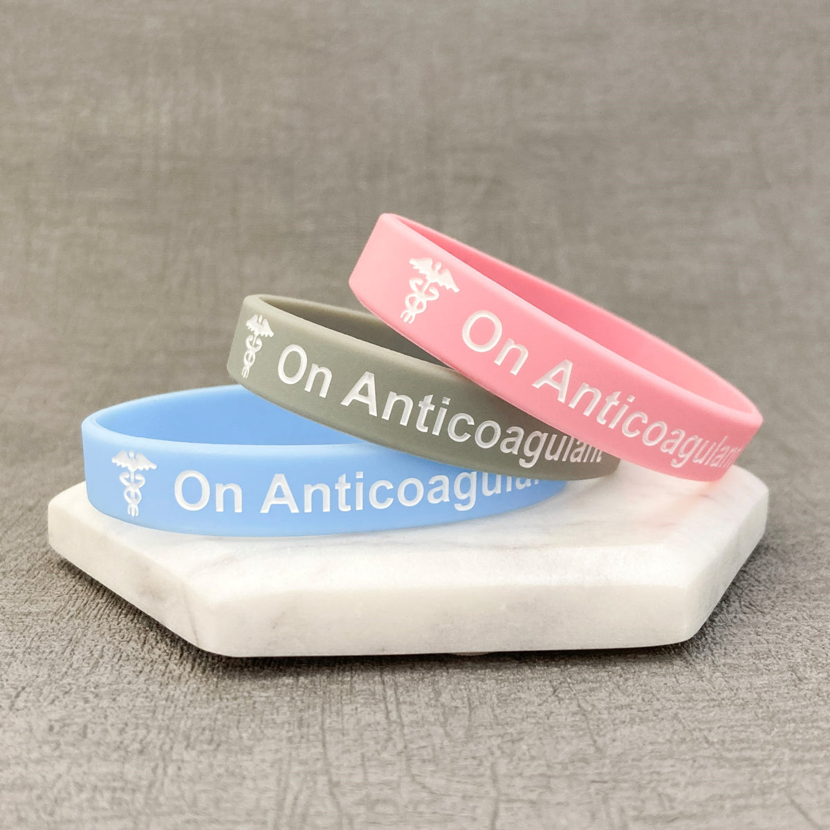 anticoagulant awareness bands pink grey sky