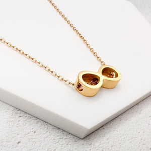 golden-tone stainless steel infinity slider charm on a chain necklace 