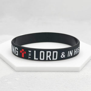 black band with white text and a red cross against a white background