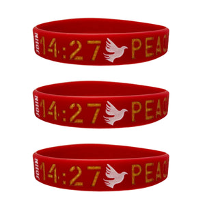 three red wristbands with gold text and a white dove against a white background