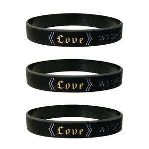 Three black wristbands with bible verse text on a white background