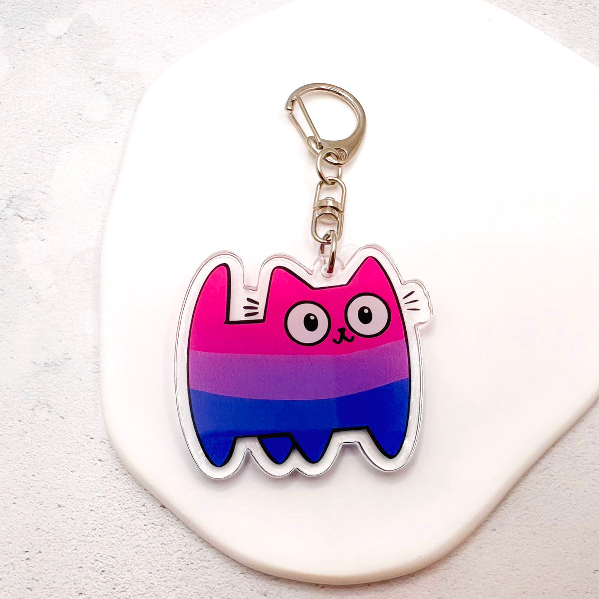 bisexual pride cat keychain in the bi colours of pink, purple, and blue