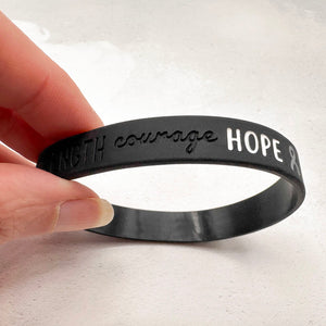 black silicone wristband engraved with ‘courage hope’ 
