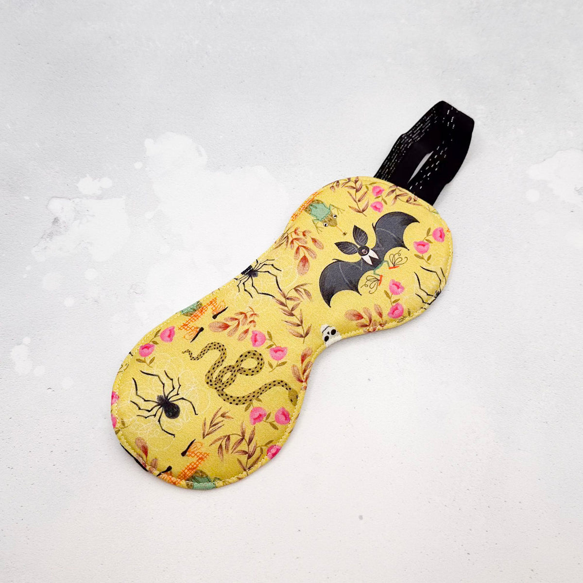 Sleep mask with Halloween-themed design 