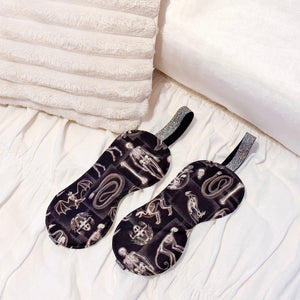 two sleep masks with x-ray animal design on a bed