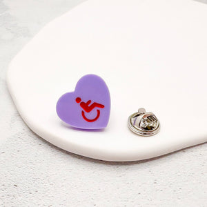 purple acrylic heart pin with disabled symbol in red