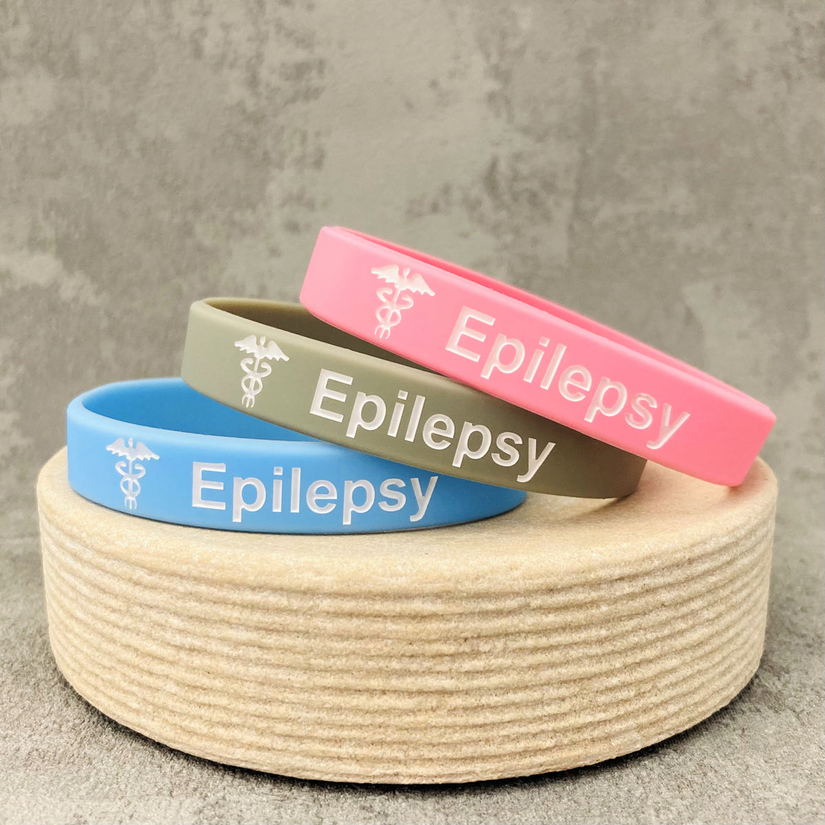 epileptic wristbands pink grey sky