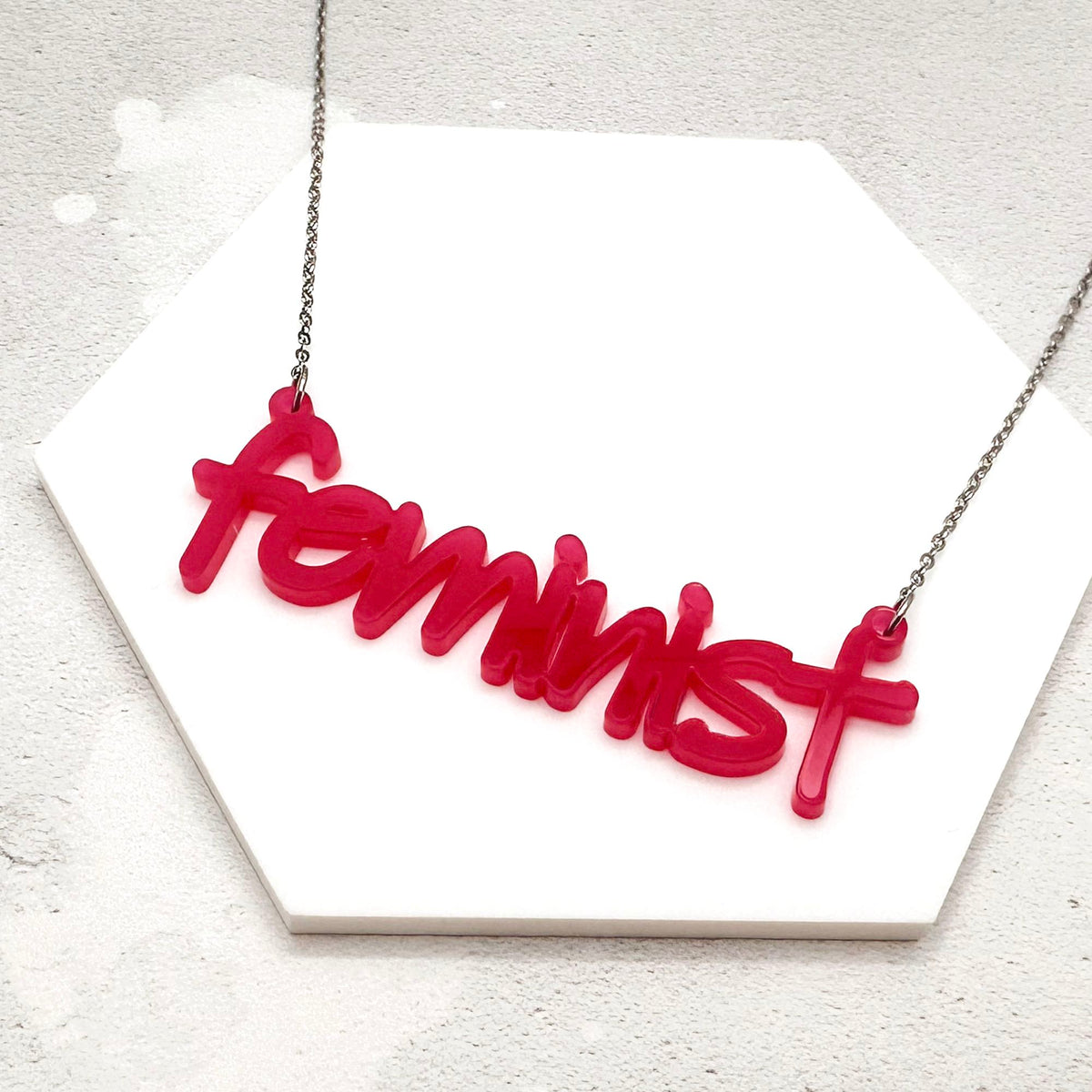 hot pink acrylic feminist necklace on a stainless steel chain