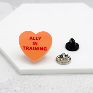 lgbt ally in training pin queer present