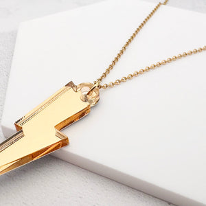 lightning bolt necklace golden acrylic close up