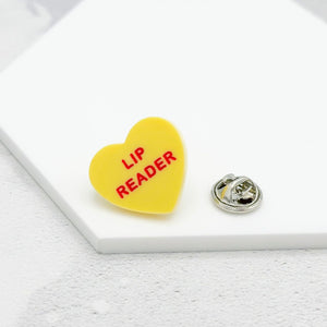 lip reader pin yellow acrylic