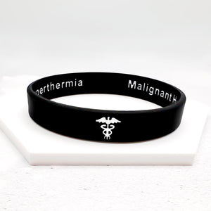 Black wristband with white text and symbols on a white background
