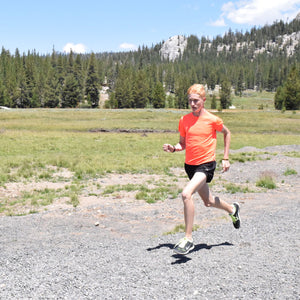 man running wearing medical bracelet