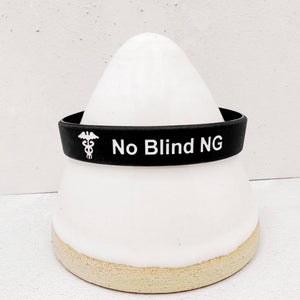 Close-up of No Blind NG alert wristband showing clear medical identification text