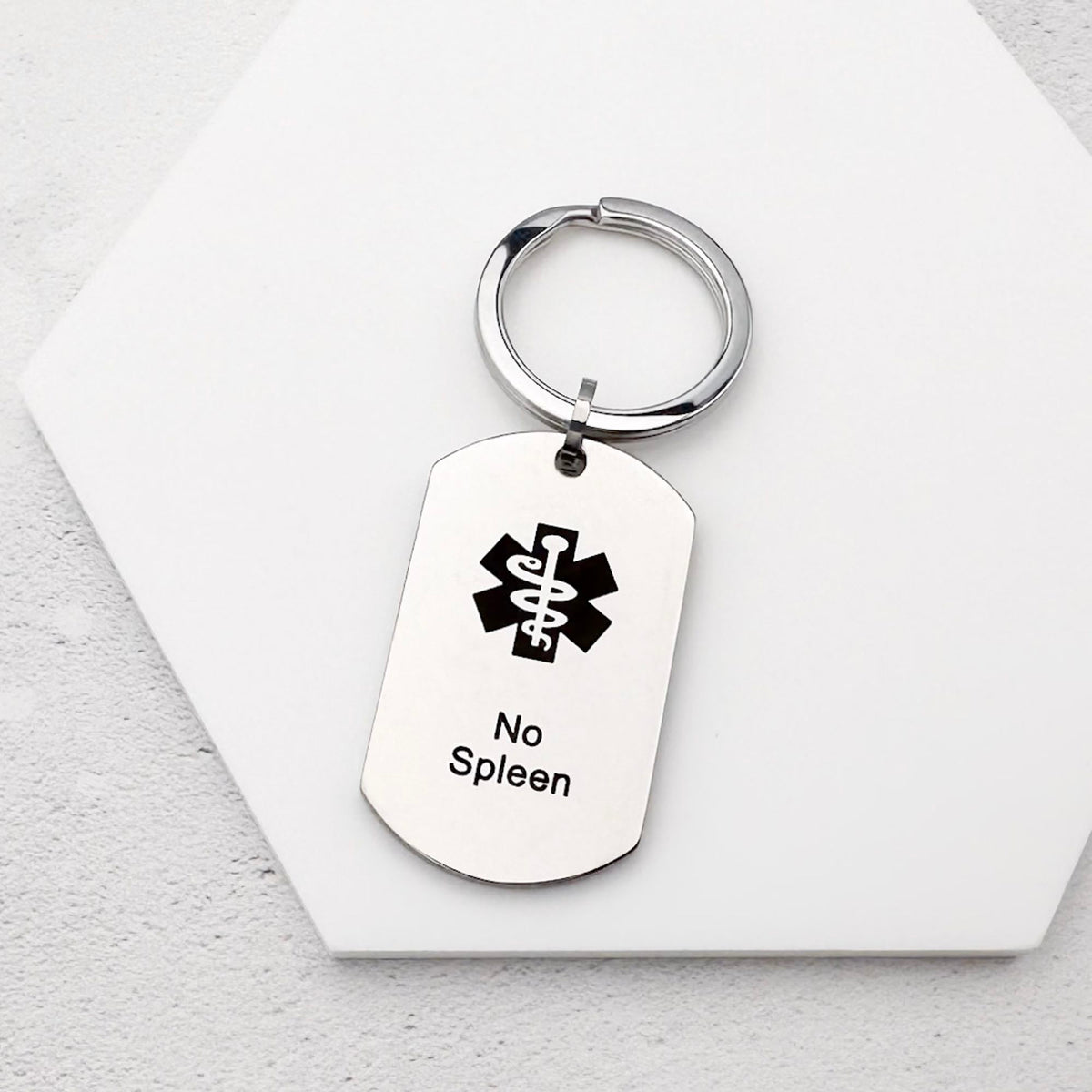 stainless steel keychain with star of life medical symbol and 'No Spleen' text