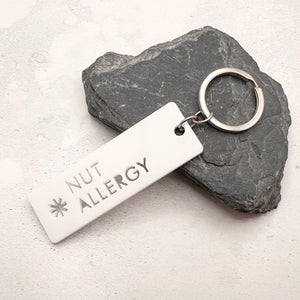 Lightweight nut allergy medical alert keychain showing laser cut design and durable acrylic material