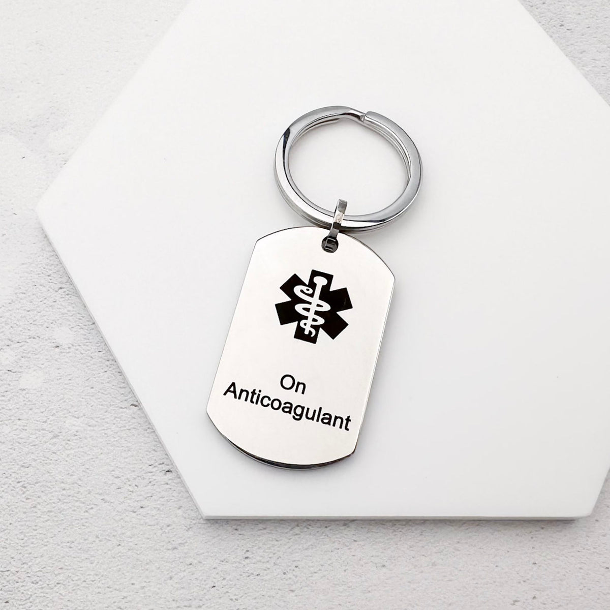 stainless steel keychain with star of life medical symbol and 'On Anticoagulant' text