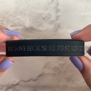 Black silicone 1 John 4:19 Bible verse bracelet shown from multiple angles