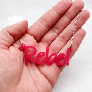 handmade acrylic hot pink rebel necklace on a stainless steel chain