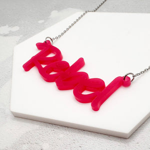 acrylic hot pink rebel necklace on a stainless steel chain