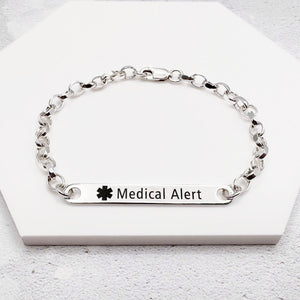 Silver medical alert bracelet on a white background