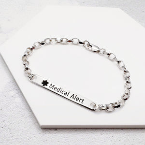 Silver medical alert bracelet on a white background