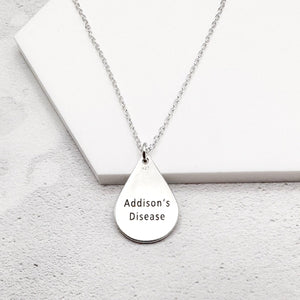 sterling silver medical alert necklace with "Addison's Disease" on a teardrop-shaped pendant