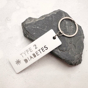 Type 2 Diabetes medical alert keychain laser cut from white acrylic with silver keyring
