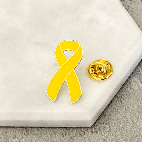 yellow awareness ribbon pin cancer support
