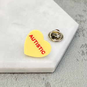 heart pin for autism awareness yellow